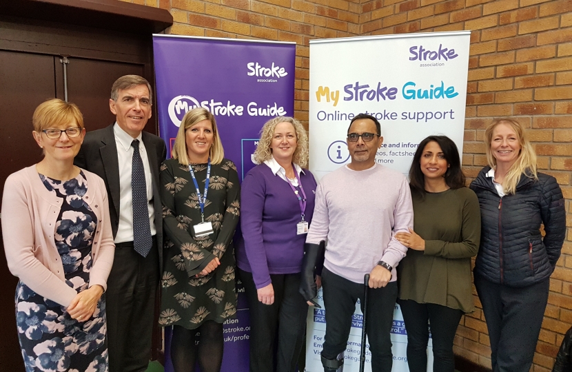 David Rutley MP with, l-r, Ms Bernadette Bailey (Eastern Cheshire Clinical Commissioning Group); Ms Cheryl Cooper (Eastern Cheshire Clinical Commissioning Group); Ms Jayne Humphreys (Stroke Association Support Coordinator, Macclesfield); Santokh (local stroke survivor), Nielam (Santokh’s wife); and Ms Cathy Armstrong (Community Neurophysiotherapist)