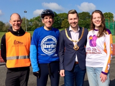 David Rutley MP with, l-r, Darren Allgood, Mayor of Macclesfield Adam Schofield, and a participant in the Bikeathon from Just Drop-In