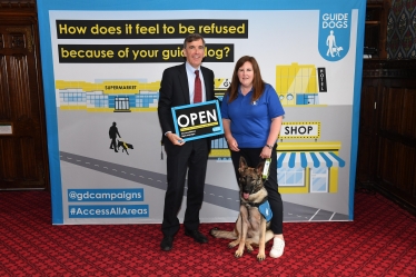 David Rutley MP with Guide Dogs representative Sarah with puppy, Quaver